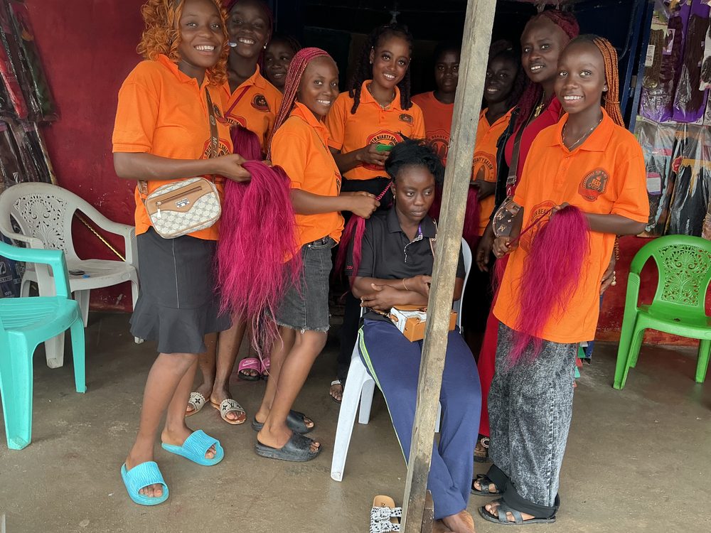 Face of Beauty trainees smiling together in Buchanan