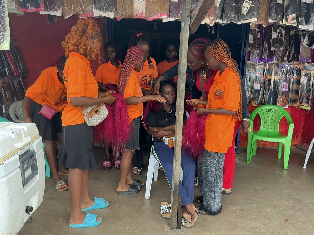 Face of Beauty trainees practicing hair techniques